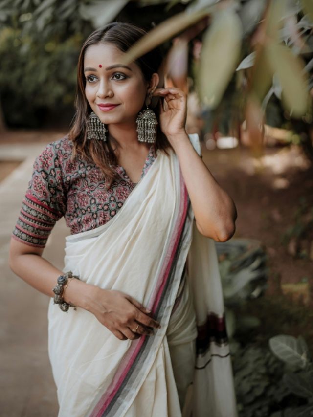 One Hand on Jhumka Photoshoot Pose in Saree