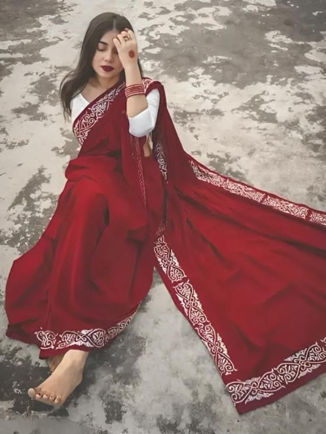 Sitting on Rooftop Holding Hair Saree Pose