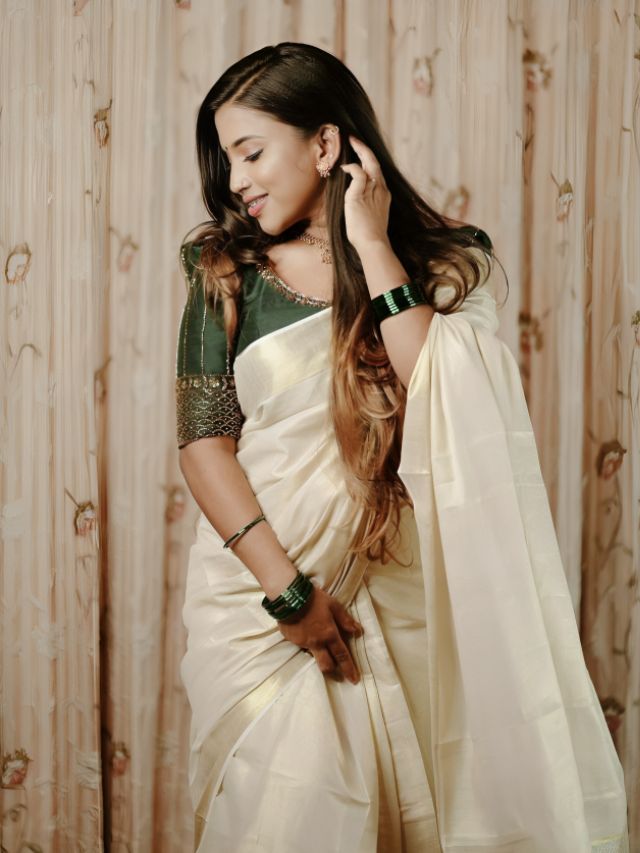 Standing saree pose with face down for girl